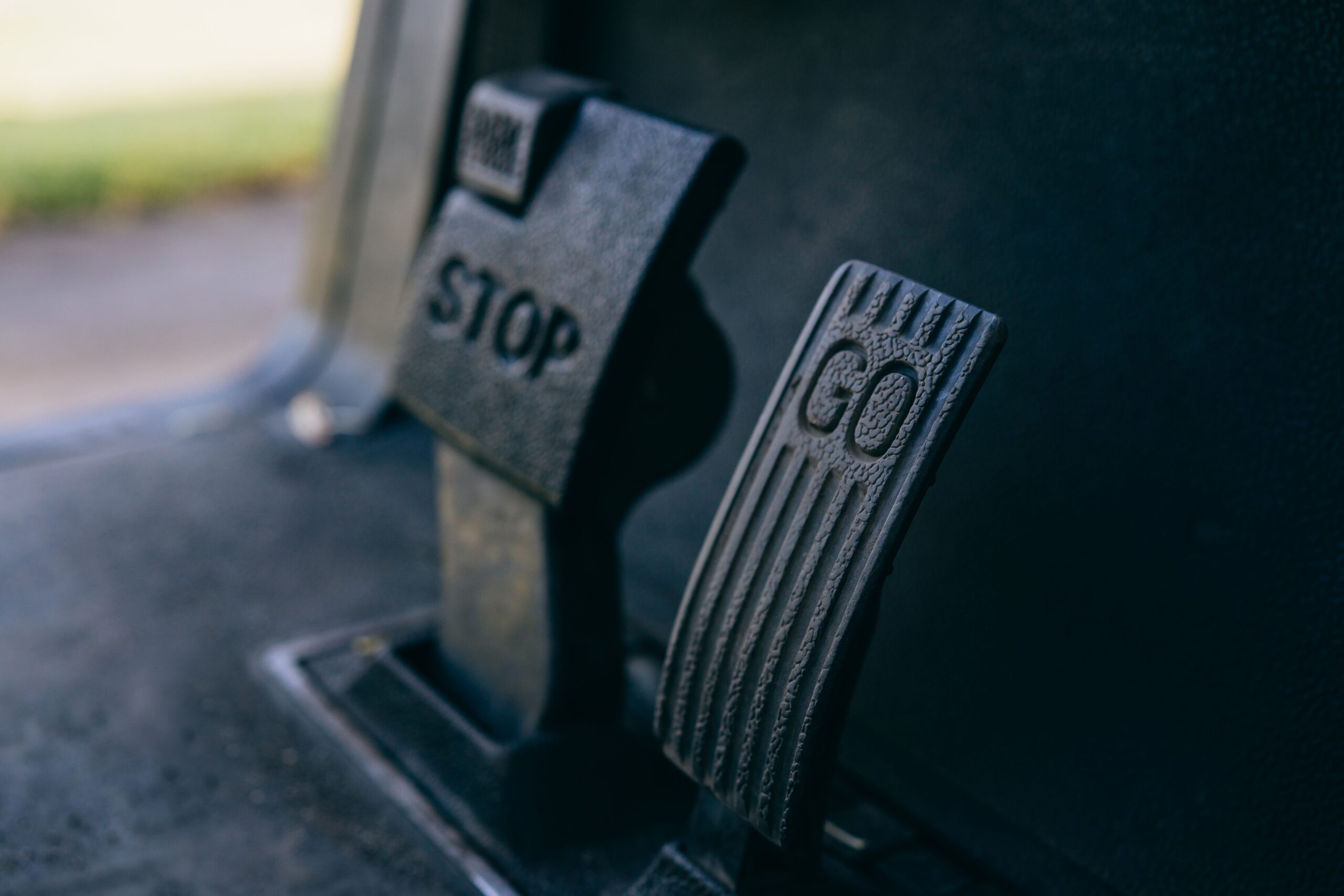 which pedal is the brake in a car